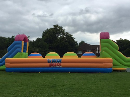 colourful big balls challenge inflatable in a field